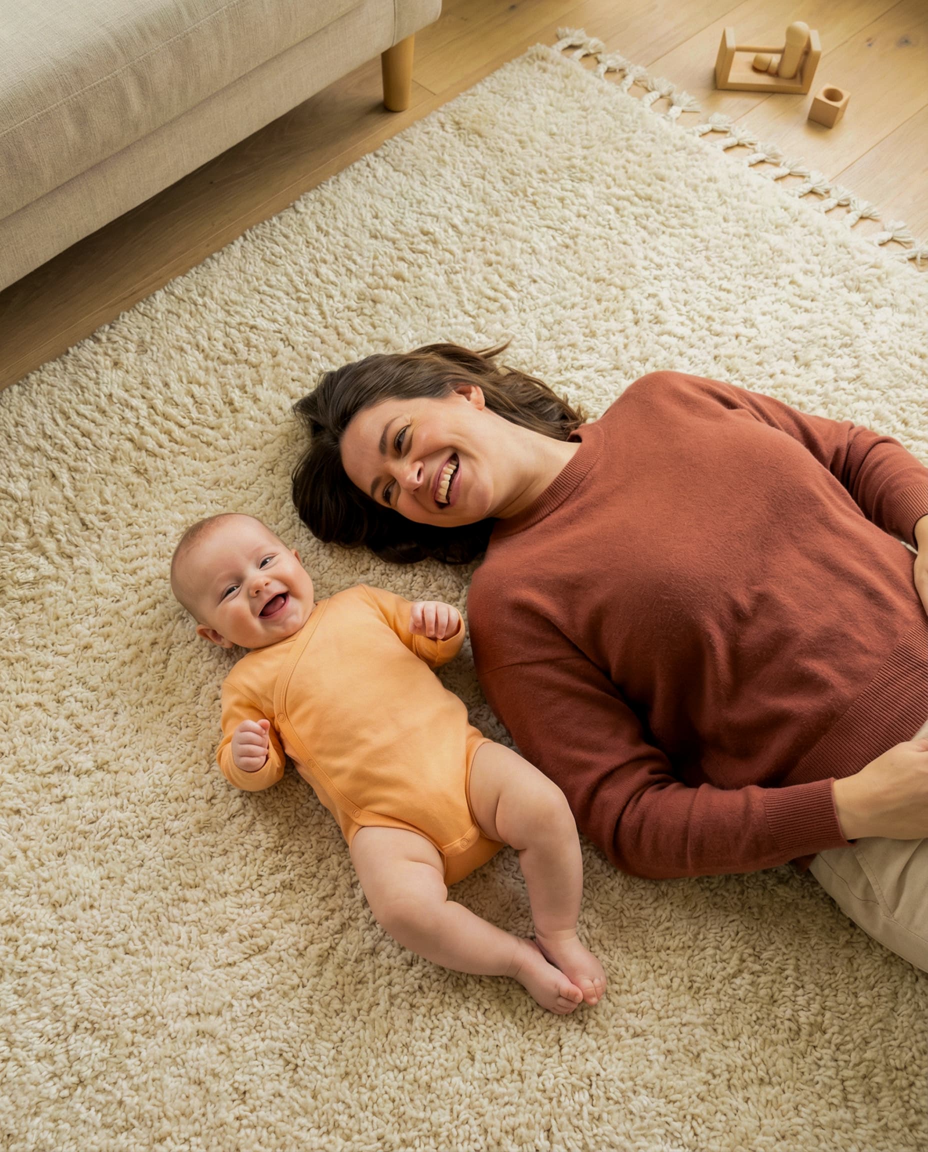 Parent and baby resting together at home